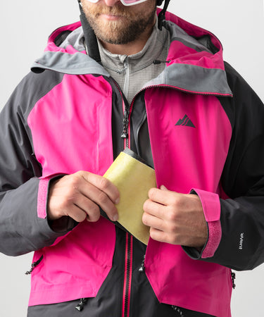 studio on-model image of strafe outerwear 2023 nomad 3l shell jacket in fuchsia color