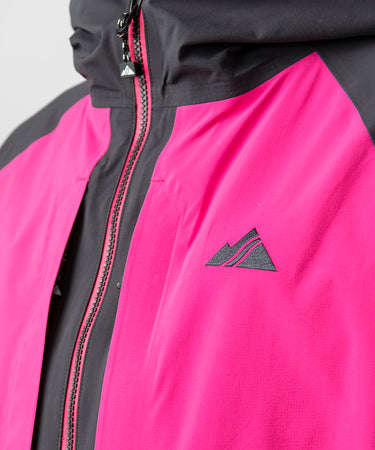 studio on-model image of strafe outerwear 2023 nomad 3l shell jacket in fuchsia color