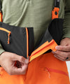 studio image of strafe outerwear 2023 cham 3l shell pant in tangerine color