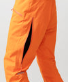 studio image of strafe outerwear 2023 cham 3l shell pant in tangerine color