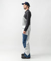 studio on-model image of strafe outerwear 2023 nomad 3l shell bib in frost grey color