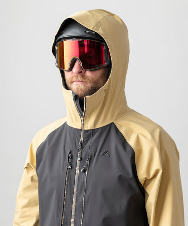 studio on-model image of strafe outerwear 2023 ms sickbird 3l shell suit in dune color