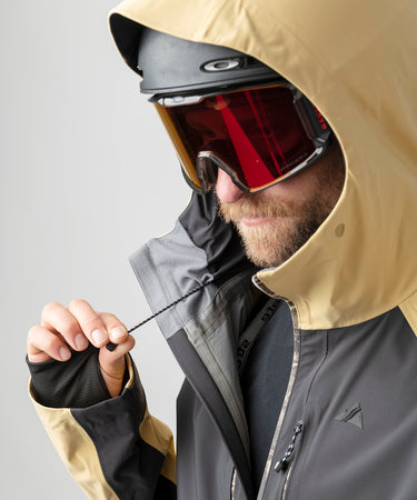 studio on-model image of strafe outerwear 2023 ms sickbird 3l shell suit in dune color