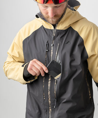 studio on-model image of strafe outerwear 2023 ms sickbird 3l shell suit in dune color
