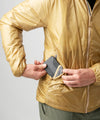studio on-model image of strafe outerwear 2023 ms ultralight aero insulator in dune color