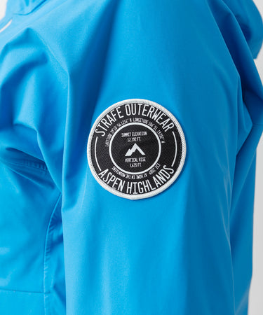 studio on-model image of strafe outerwear 2023 lynx 3l shell pullover in cobalt color