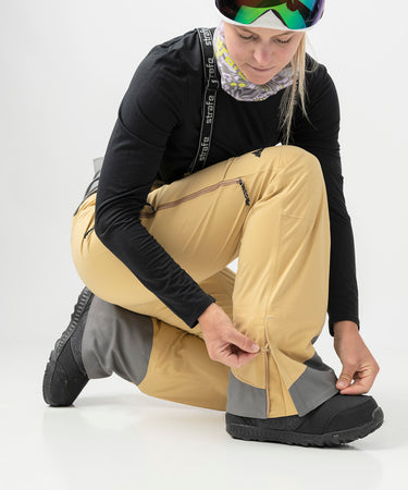 studio on-model image of strafe outerwear 2023 willow 3l shell half bib in dune color