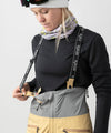 studio on-model image of strafe outerwear 2023 willow 3l shell half bib in dune color