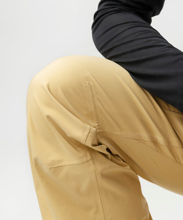 studio on-model image of strafe outerwear 2023 willow 3l shell half bib in dune color