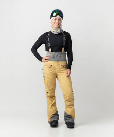 studio on-model image of strafe outerwear 2023 willow 3l shell half bib in dune color