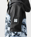 studio on-model image of strafe outerwear 2023 strafe x shredly meadow jacket in tie dye splatter color
