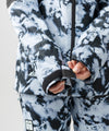 studio on-model image of strafe outerwear 2023 strafe x shredly meadow jacket in tie dye splatter color