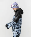 studio on-model image of strafe outerwear 2023 strafe x shredly meadow jacket in tie dye splatter color