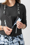 studio on-model image of strafe outerwear 2023 strafe x shredly scarlett bib in tie dye splatter color
