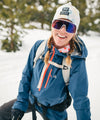 smiling in navy cham pullover